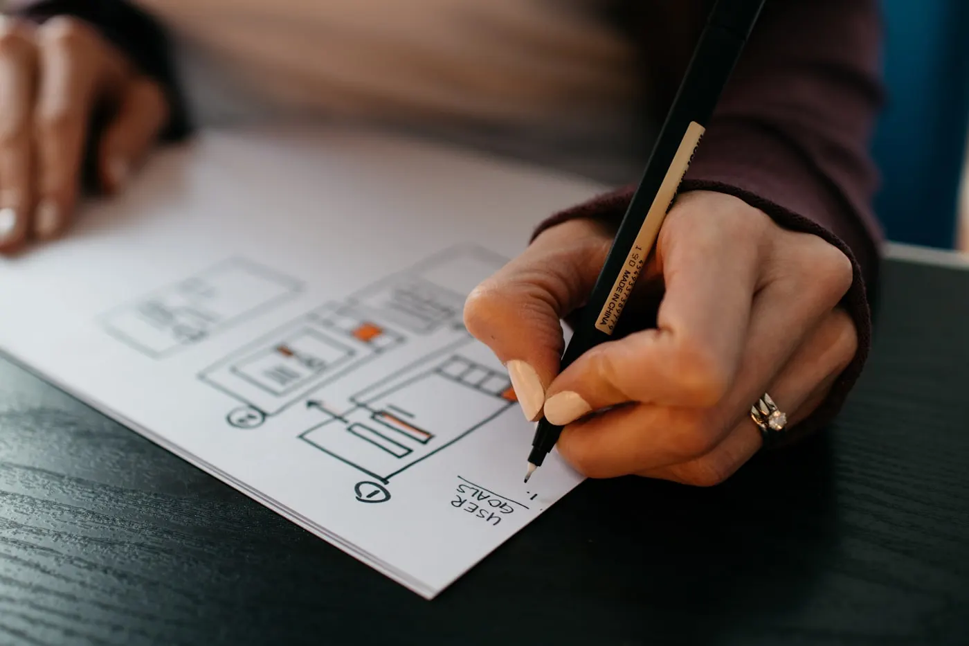 Designer building a component library and design system on screen